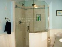 A neo-angle custom glass shower with country style bead board wainscoating
